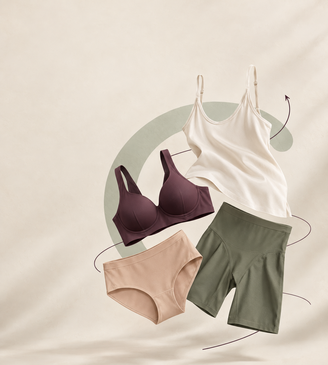 Everyday comfort set: aubergine bra, ivory camisole, nude brief and sage green shaping shorts arranged on a light background